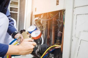 Technician fixing ac