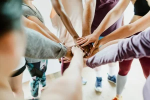 Group of people stacking their hands